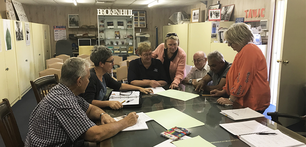 Broken Hill museum volunteers meet in the research room at the rear of the Synagogue of the Outback with Museum Advisor, Kate Gahan.