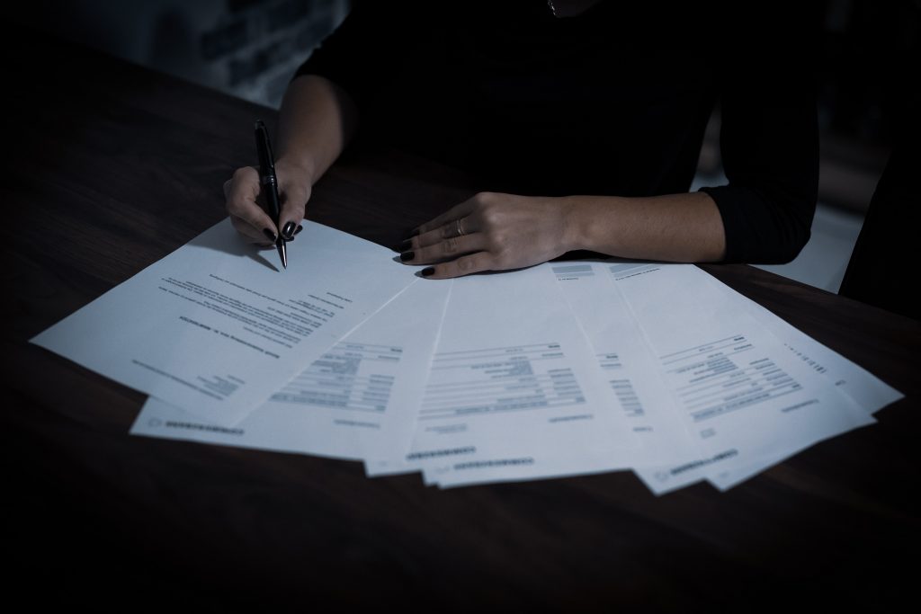 Contract being signed - Photo by Dimitri Karastelev on Unsplash